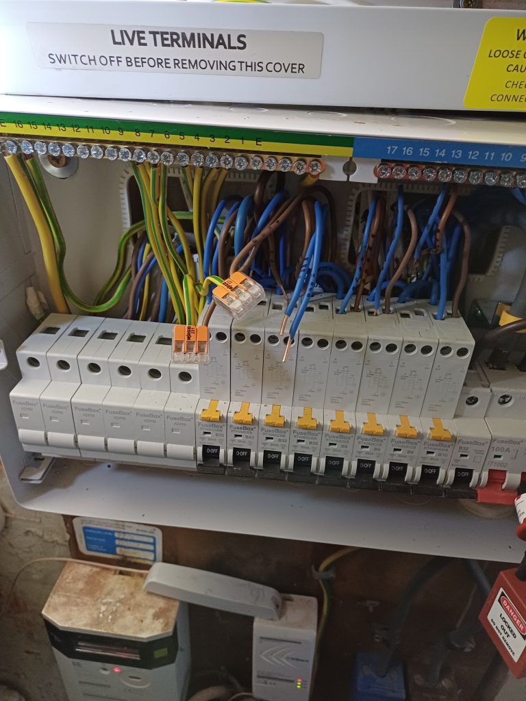 Consumer unit part-way through wiring, with circuit cables connected to the breakers